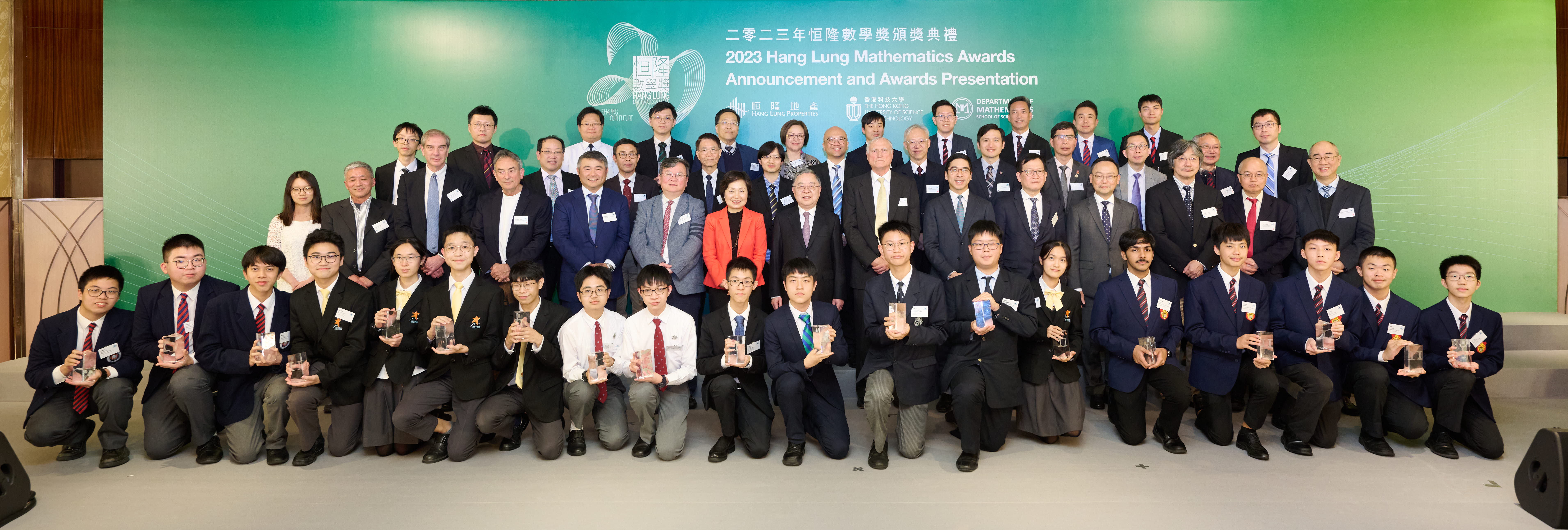 A photo of the winning teams of the 2023 Hang Lung Mathematics Awards with Dr. Christine CHOI, Secretary for Education of the Hong Kong Special Administrative Region (seventh left, second row); Mr. Ronnie C. CHAN, Chair (eighth left, second row); Mr. Adriel CHAN, Vice Chair (sixth right, second row); and Mr. Weber LO, Chief Executive Officer of Hang Lung Properties (fifth left, second row); Prof. GUO Yike, HKUST’s Provost (sixth left, second row); Prof. WANG Yang, HKUST’s Vice-President for Institutional Advancement (second right, second row); 2023 Hang Lung Mathematics Awards Scientific Committee Chair, Prof. Richard SCHOEN, 2017 Wolf Prize Laureate in Mathematics (seventh right, second row), and members of Scientific Committee, Steering Committee, Executive Committee, and Screening Panel, including HKUST’s faculty members from Department of Mathematics who contributed to the competition